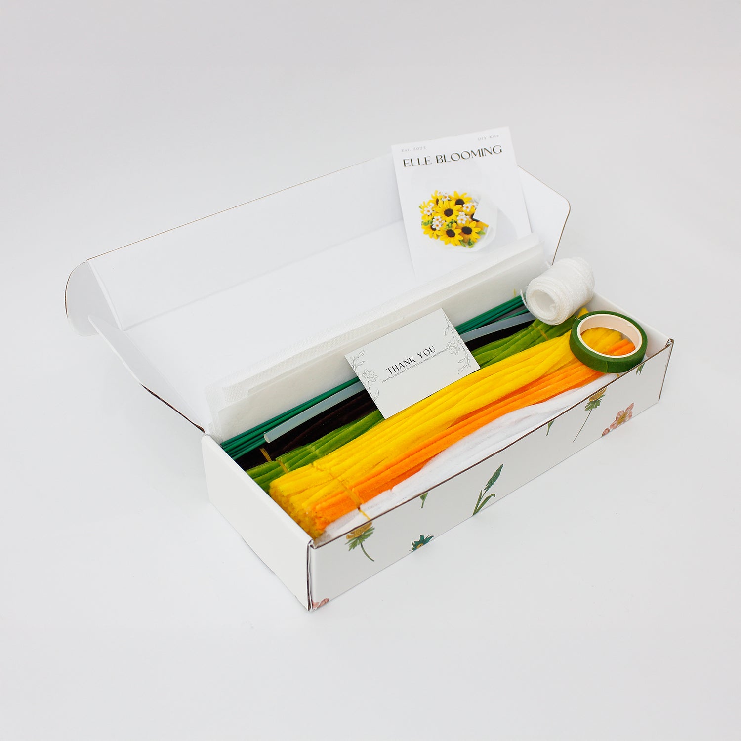 Honey Glow DIY flower bouquet made from pipe cleaners, featuring vibrant yellow sunflowers and tiny white daisy accents. Wrapped in soft white tissue paper perfect for handmade gifting, decor, or cheerful craft displays.