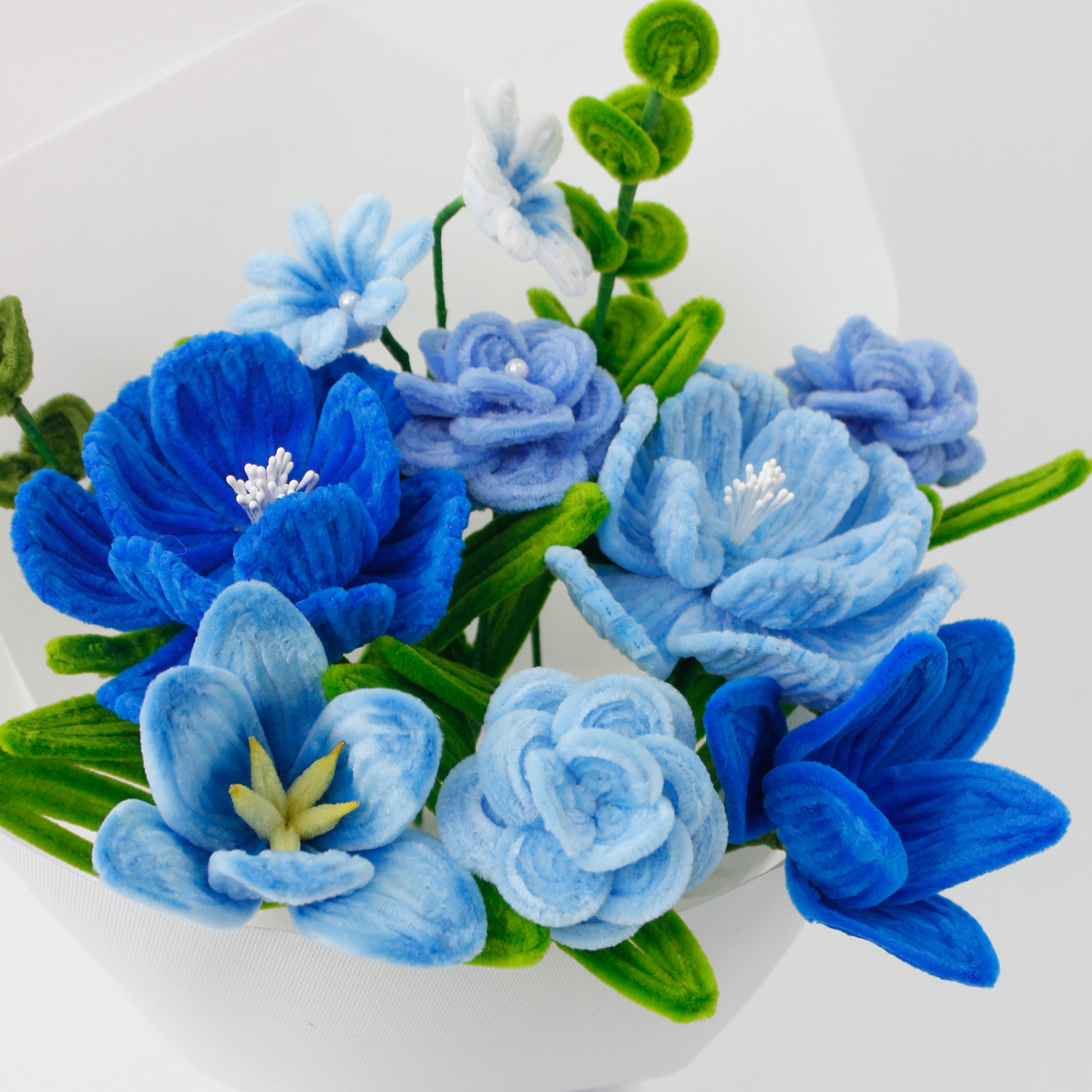 Realistic blue flower bouquet made from fuzzy pipe cleaners, featuring delicate tulips, roses, and lilies. A charming handmade gift from Elle Blooming, perfect for home decoration or meaningful occasions.
