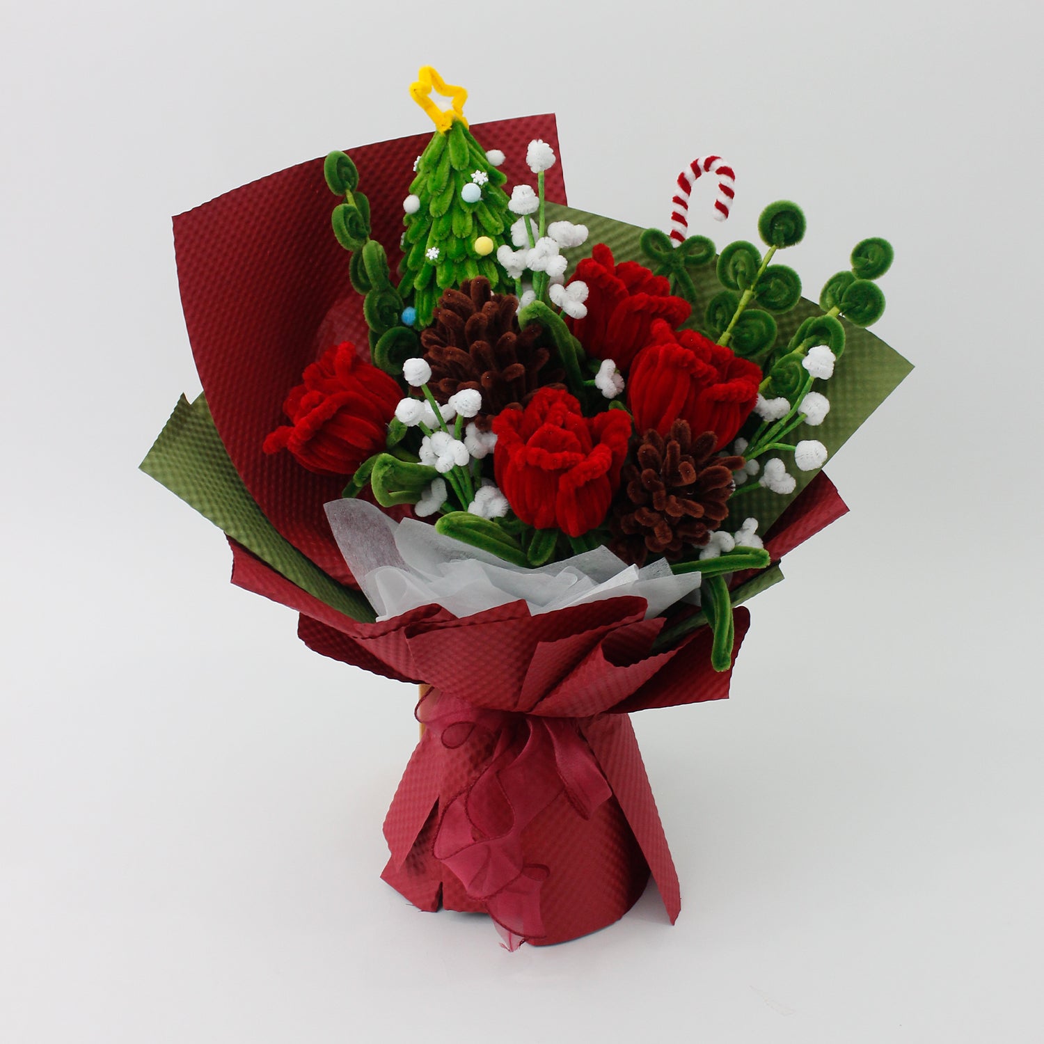 Midnight Evergreen DIY flower bouquet kit with red tulips, pinecones, white berries, candy cane, and a mini Christmas tree made from pipe cleaners. Ideal for holiday gifts or Christmas crafting fun.