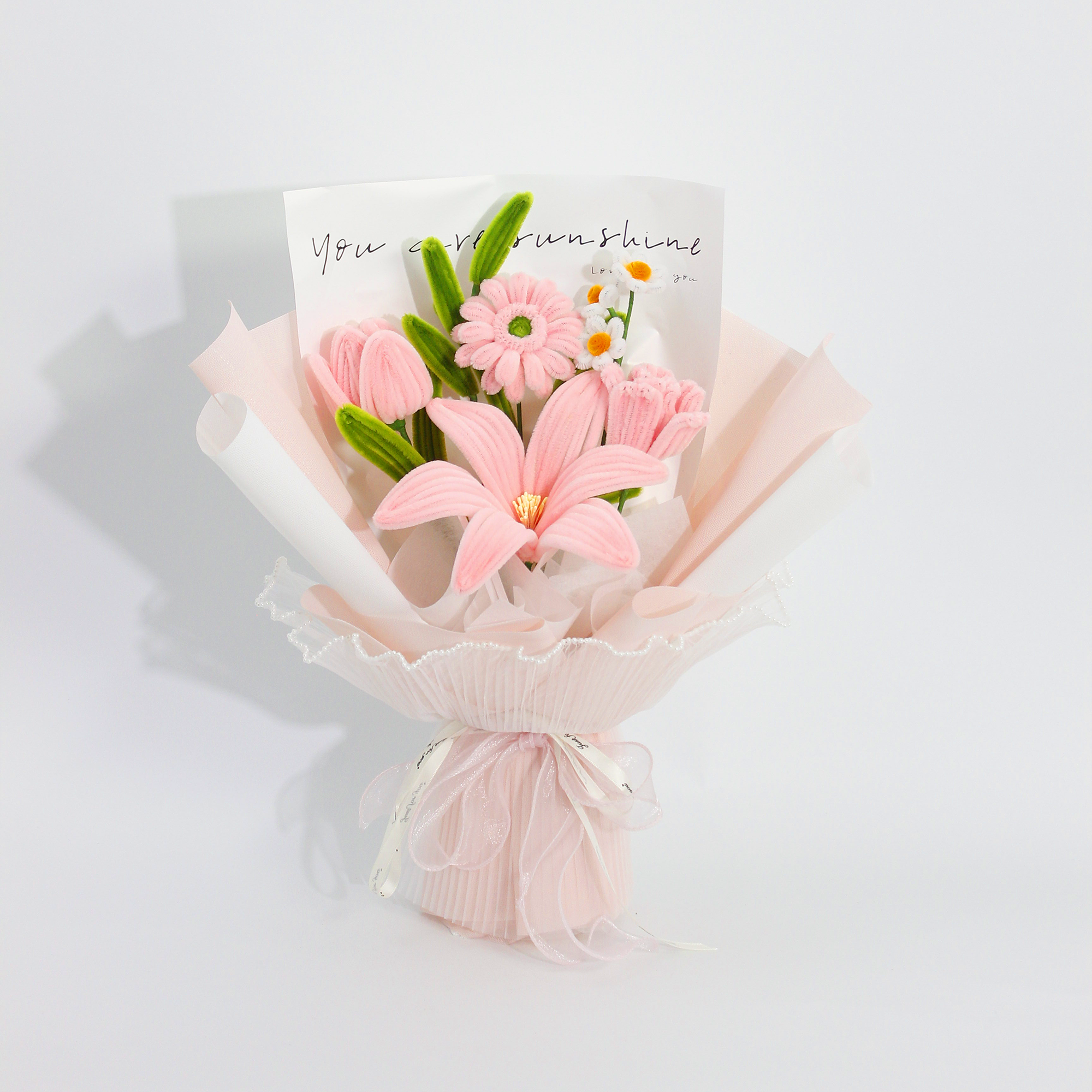 Elegant pink pipe cleaner DIY kit featuring lilies and daisies, includes full set of materials for crafting your own floral bouquet.
