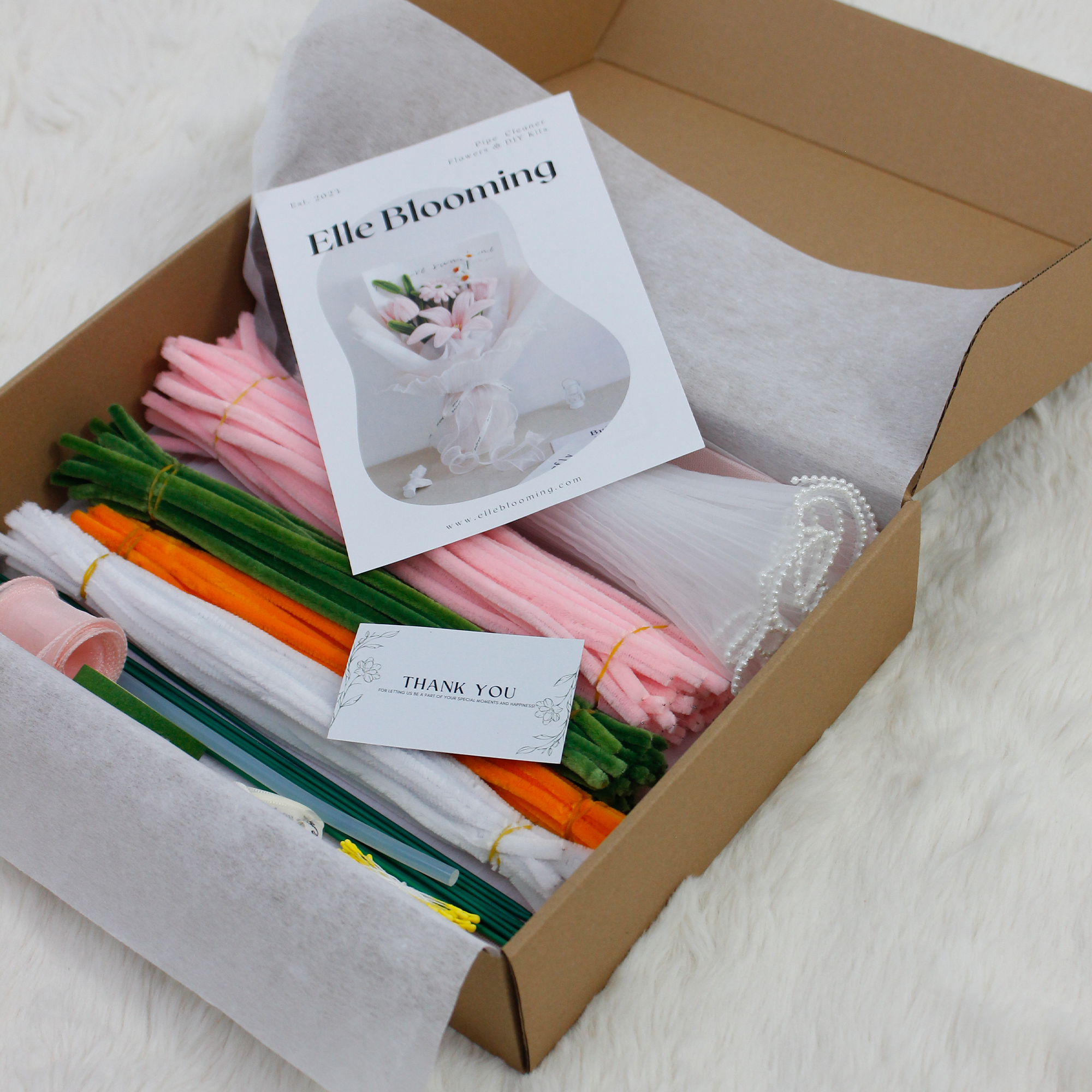 Elegant pink pipe cleaner DIY kit featuring lilies and daisies, includes full set of materials for crafting your own floral bouquet.
