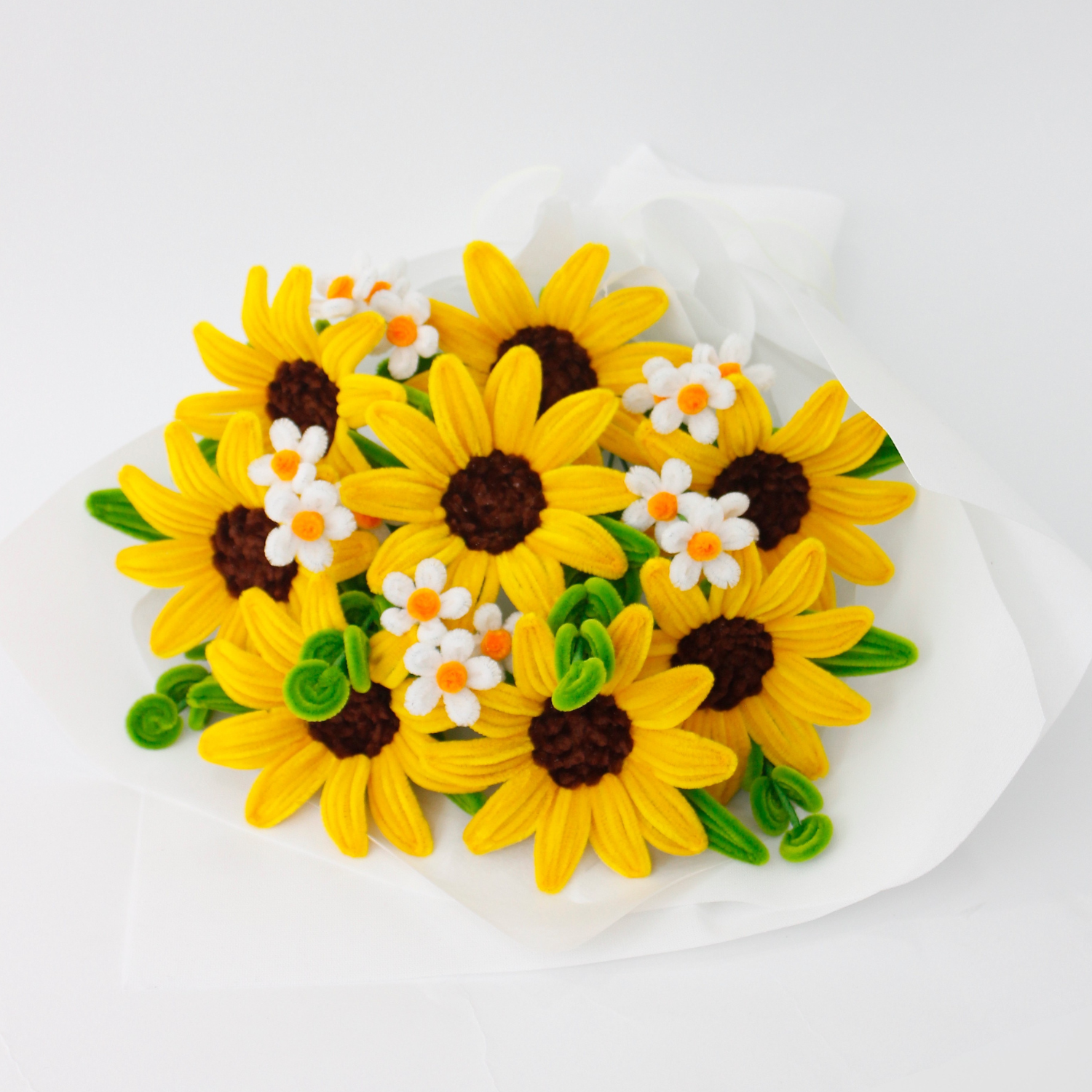 Handcrafted yellow sunflower bouquet made from fuzzy pipe cleaners, paired with small white accent flowers. A cheerful and long-lasting gift perfect for birthdays, graduations, or home decoration. Handmade by Elle Blooming.
