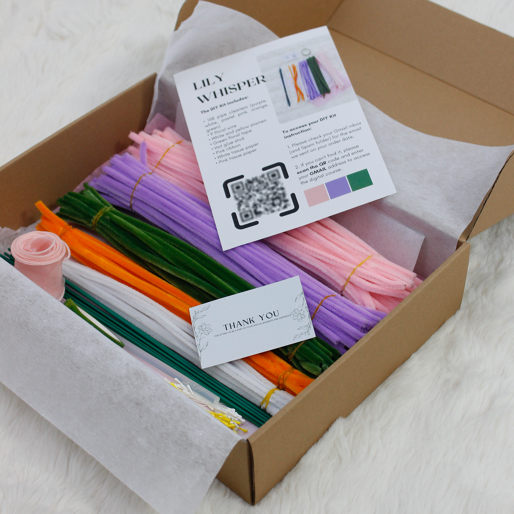 Pastel pipe cleaner bouquet DIY kit with lilies and daisies, complete with wrapping paper and crafting tools — perfect for handmade gifts and relaxing flower craft time.
