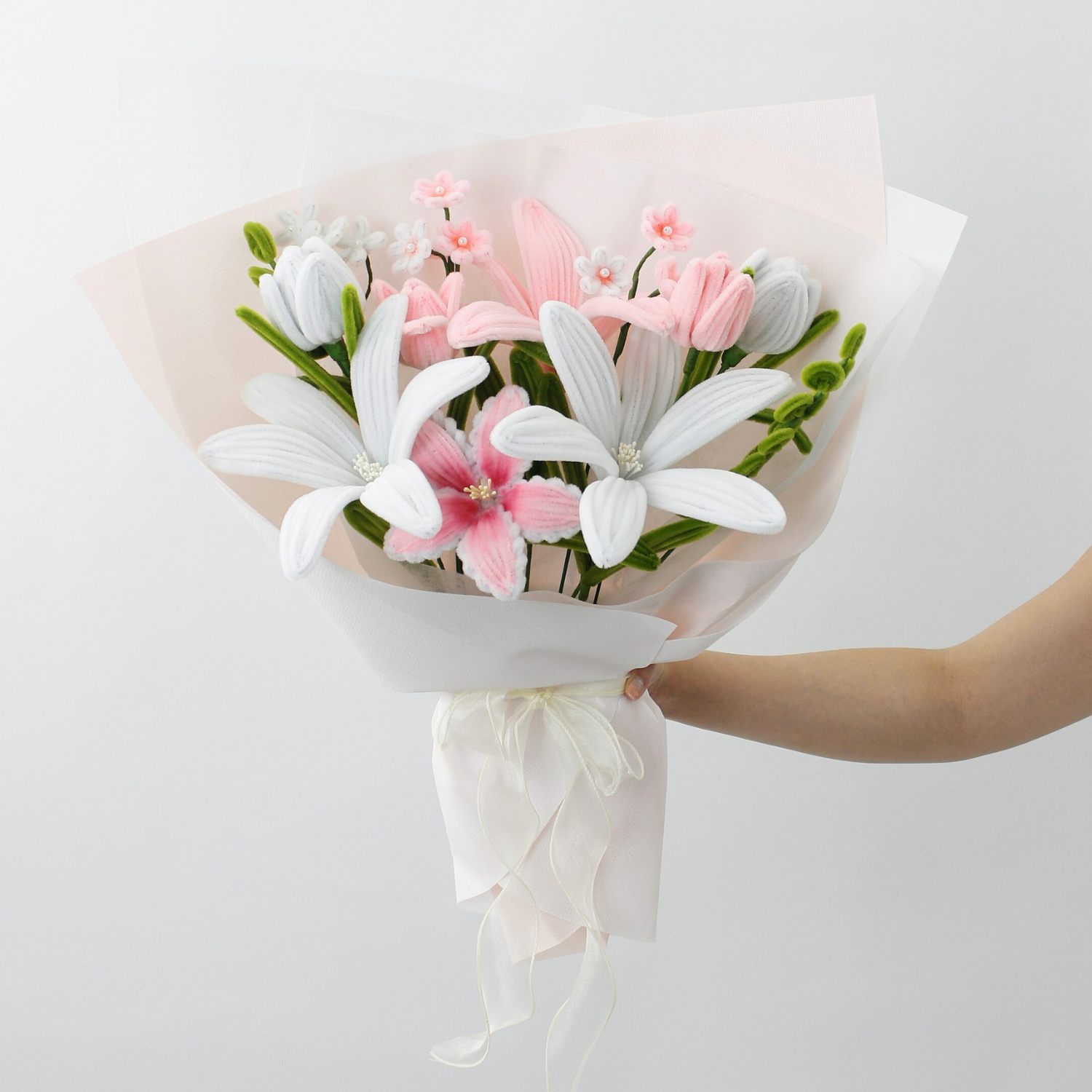 Handmade everlasting bouquet with white and pastel pink lilies, crafted from pipe cleaners, elegant finished flower arrangement gift in Australia for weddings, birthdays, and anniversaries.