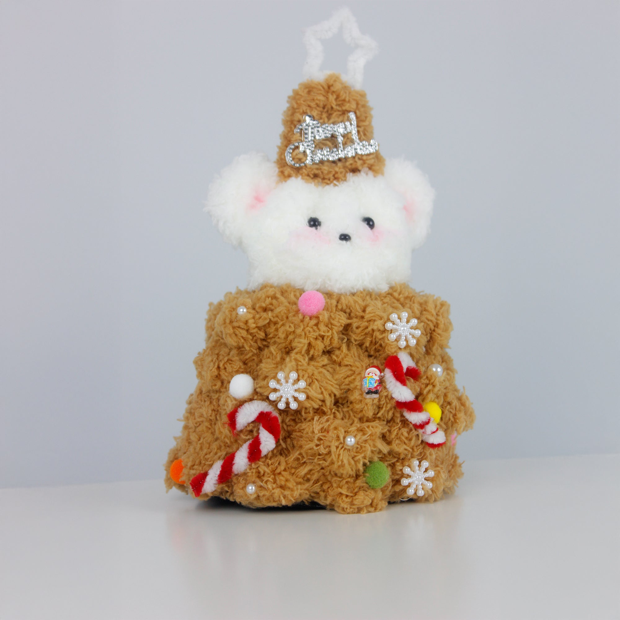 White bear dressed in a gingerbread brown outfit made from fuzzy pipe cleaners, decorated with candy canes and snowflakes. Ideal handmade Christmas gift.