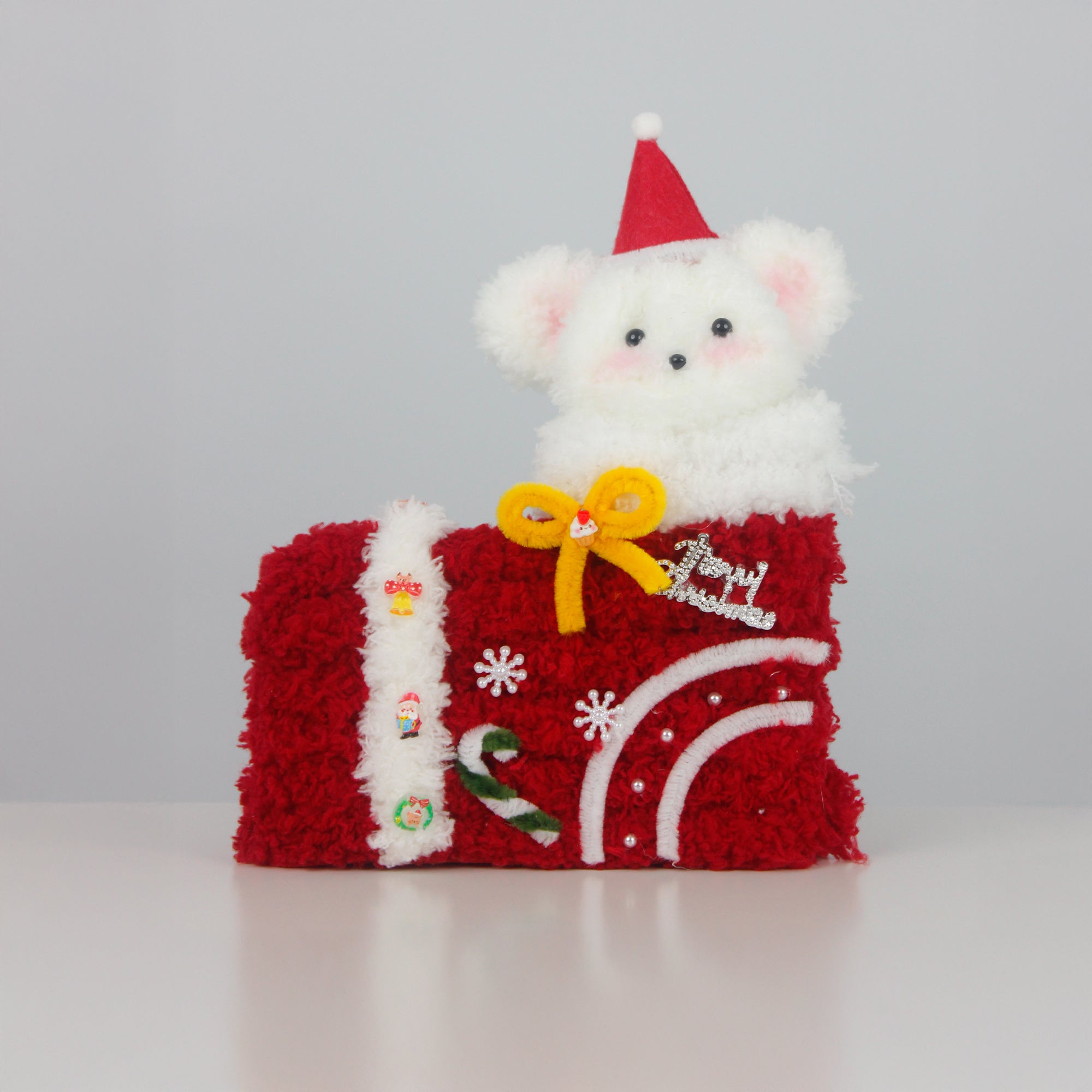 Cute white bear inside red Christmas stocking made of pipe cleaners, topped with a Santa hat and festive bow. Unique handmade Christmas gift and cozy holiday décor.
