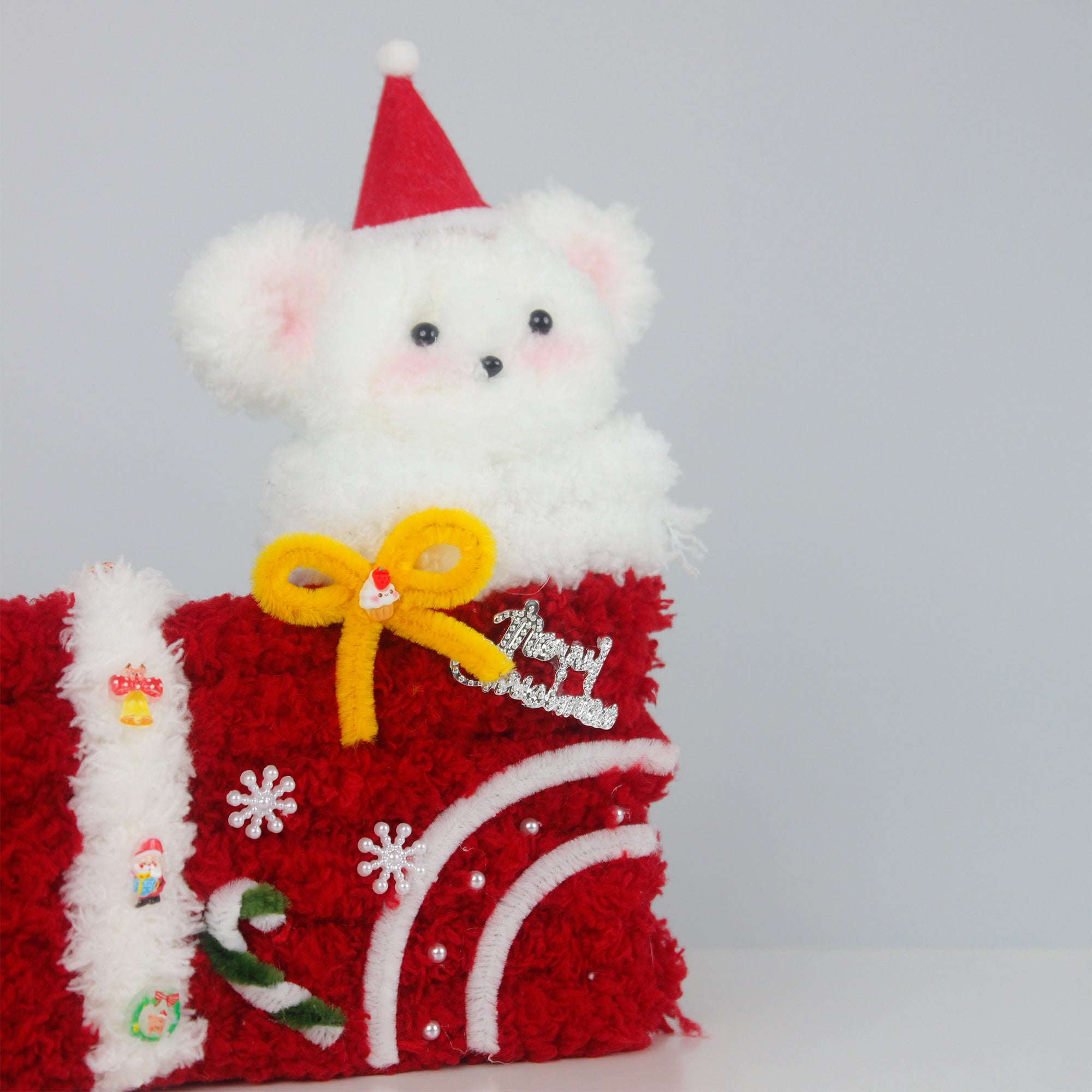 Cute white bear inside red Christmas stocking made of pipe cleaners, topped with a Santa hat and festive bow. Unique handmade Christmas gift and cozy holiday décor.
