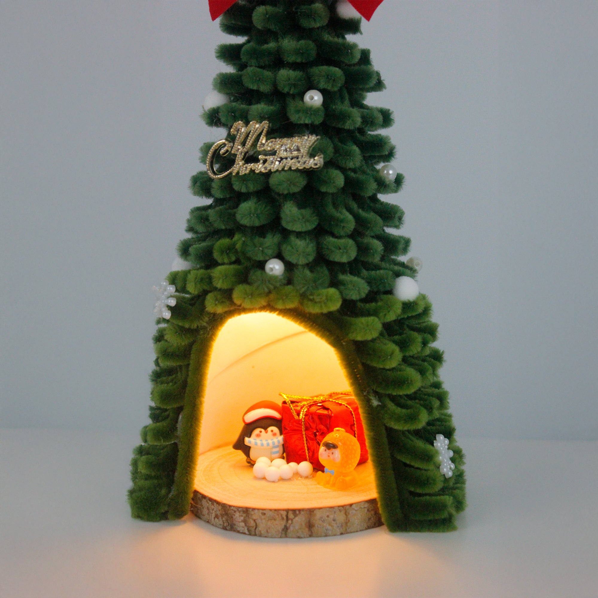 Tall pipe cleaner Christmas tree house with red gift boxes and mini snowman – ideal for DIY decor and unique handmade gifting.