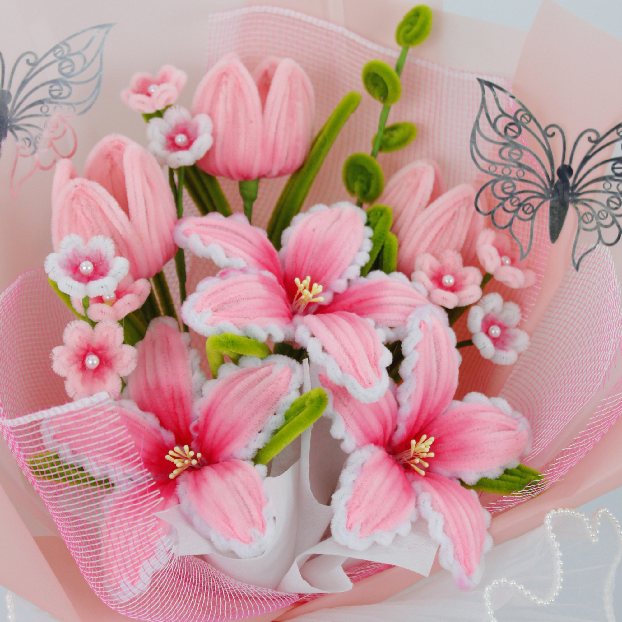 Detailed view of handmade tiger lily and tulip flowers crafted from fuzzy pipe cleaners, showing texture and elegance. Ideal forever gift for special occasions.